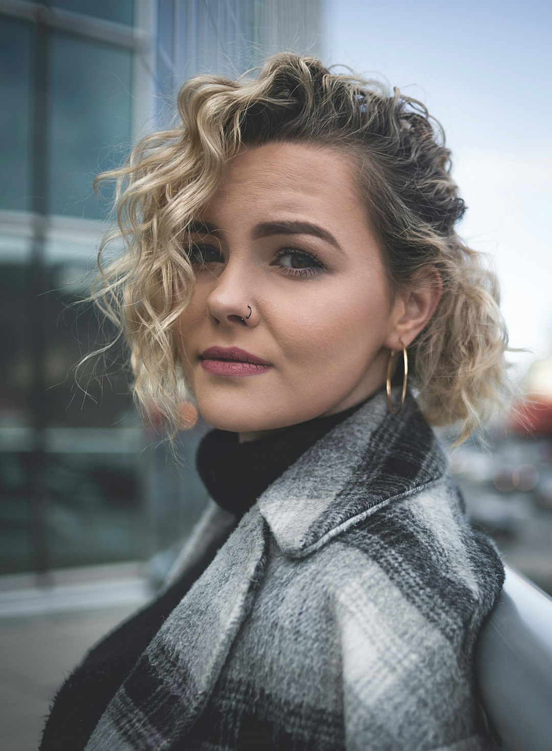 woman in gray scarf and black coat