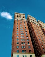 A completed brick building with a clear blue sky.