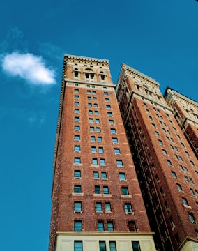 A completed brick building with a clear blue sky.