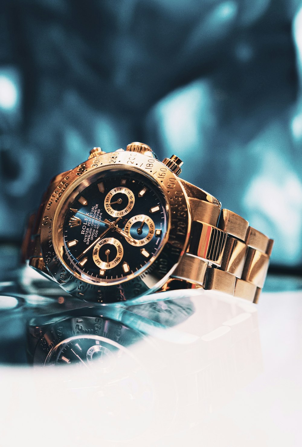 gold and black chronograph watch