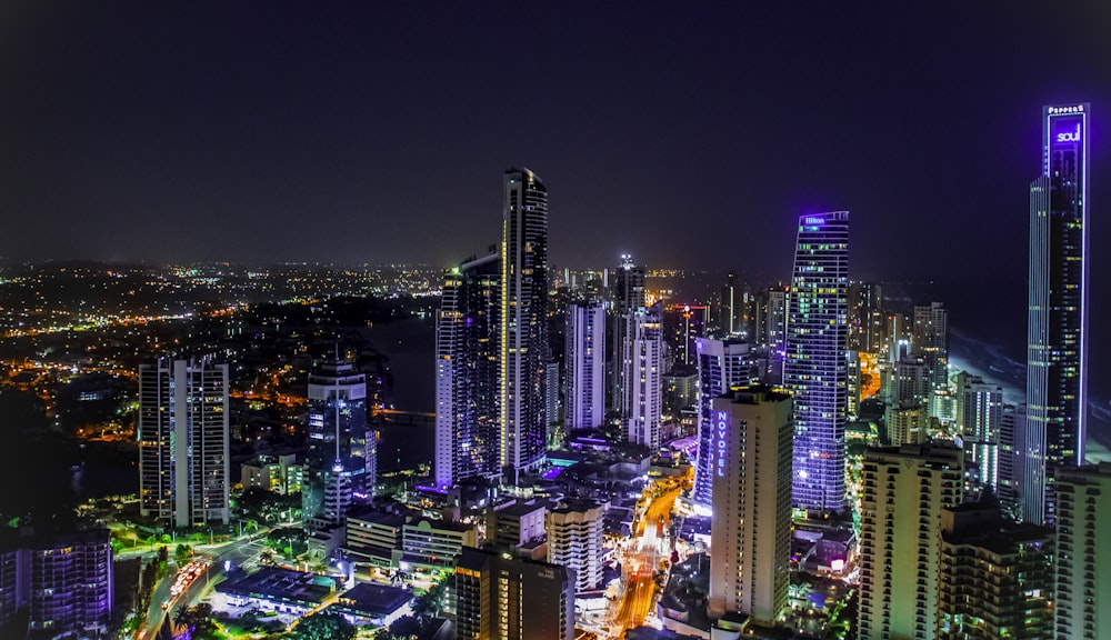 city with high rise buildings during night time