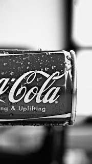 Close-up of a chilled can of maxssala's signature alcoholic beverage with condensation droplets.