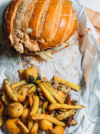 A vibrant display of fresh fast food items including gourmet sandwiches and crispy fries in elegant packaging.