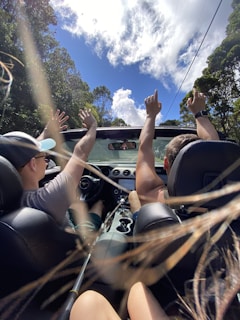A joyful couple enjoying a scenic joy ride over the Western Ghats, framed by clear blue skies.