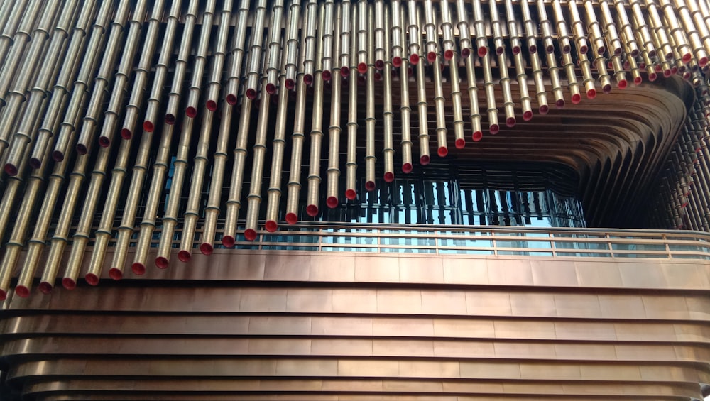 gray concrete building with red and black metal railings