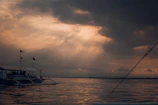 Guests enjoying a peaceful morning yacht tour with sunrays reflecting on the sea.