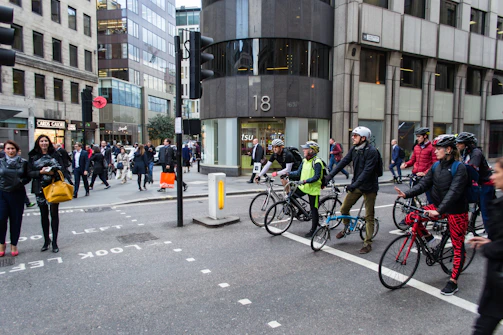 Group of robots in action at a busy city street corner.