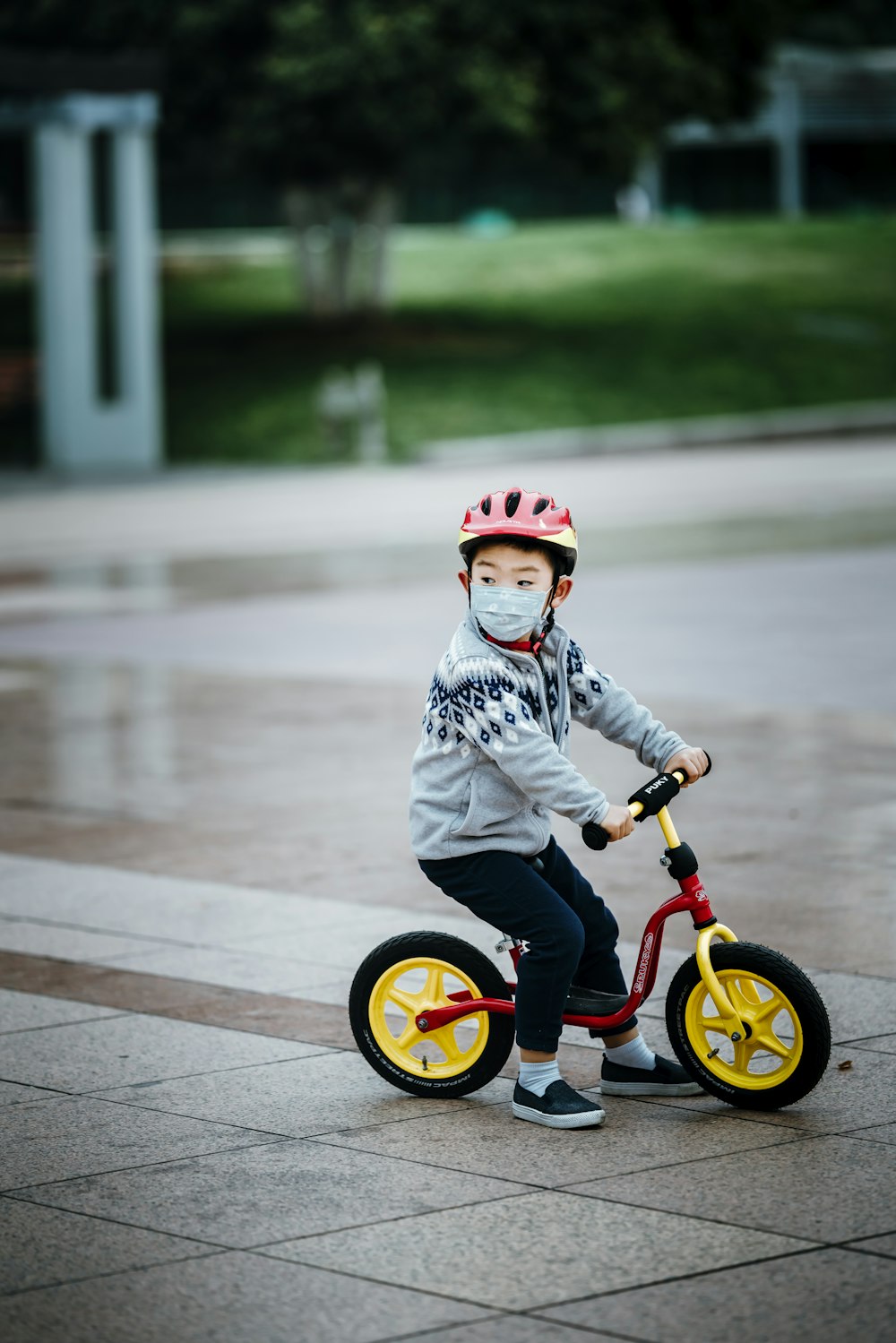 girl in white and black dress riding on bicycle during daytime