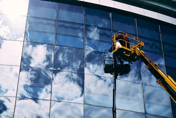 Close-up of spotless windows reflecting sunlight, showcasing expert window cleaning
