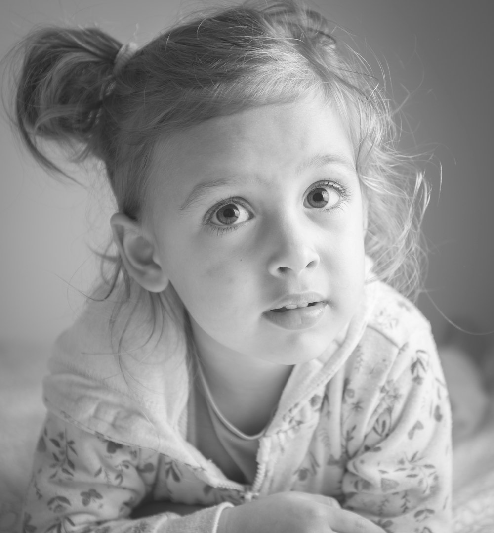 grayscale photo of girl in floral shirt