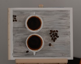 Artistic arrangement of natural herbs and coffee beans on rustic wooden surface.