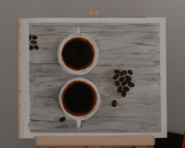 Artistic arrangement of natural herbs and coffee beans on rustic wooden surface.