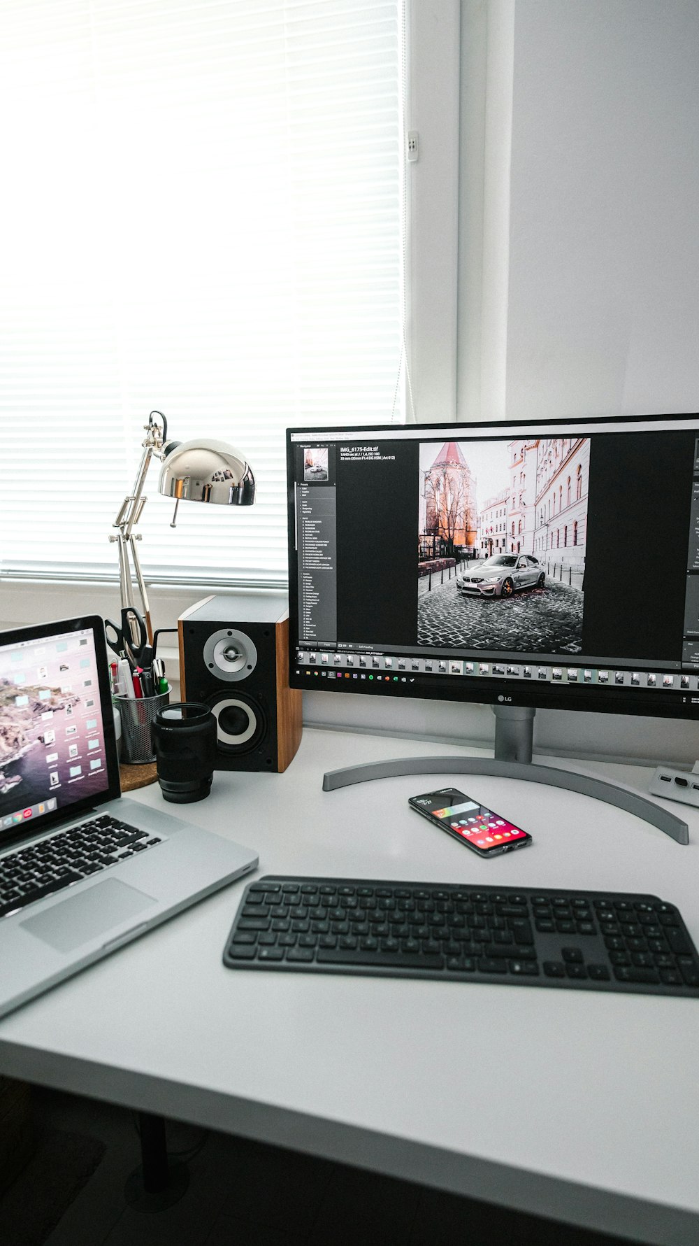 black flat screen computer monitor beside black computer keyboard and black computer speakers