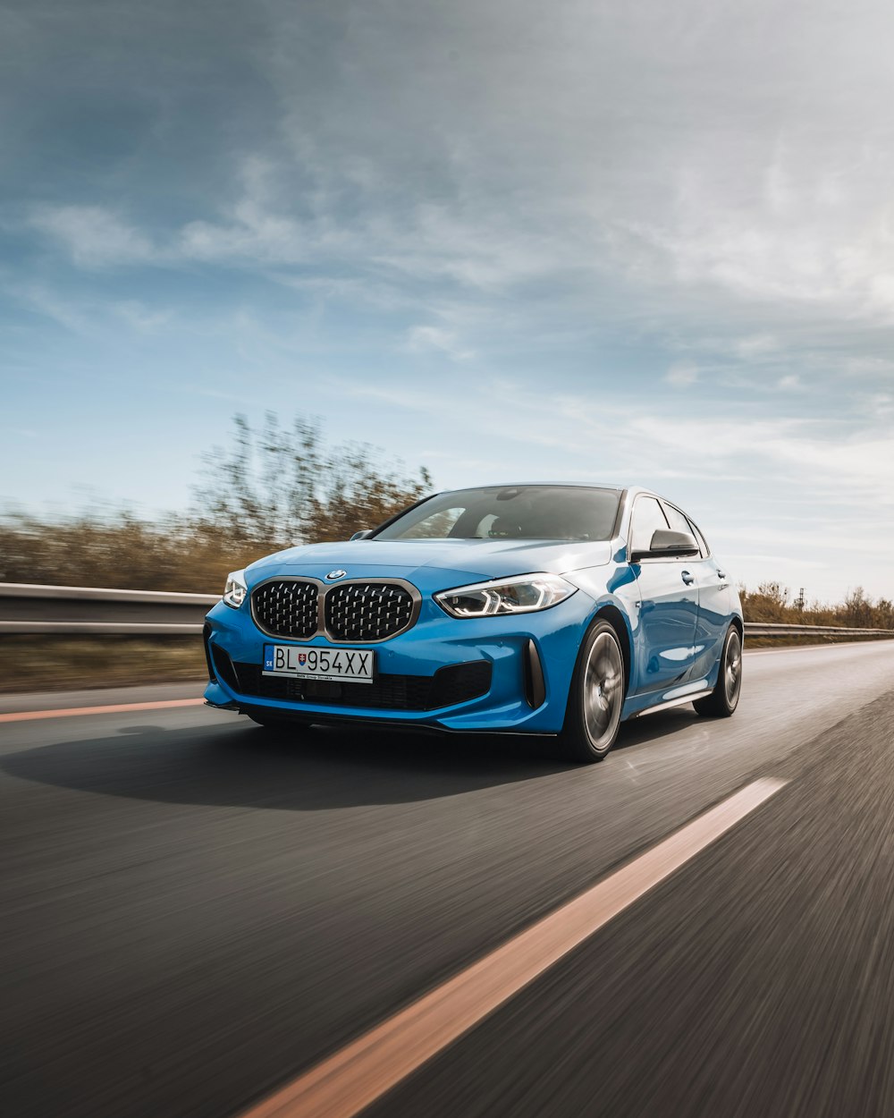 blue bmw m 3 on road during daytime