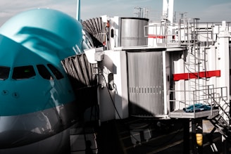 white and blue ship on dock during daytime