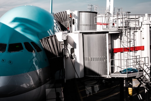 white and blue ship on dock during daytime