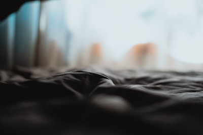 Soft focus image of linen fabric draped gently, evoking calm and simplicity.
