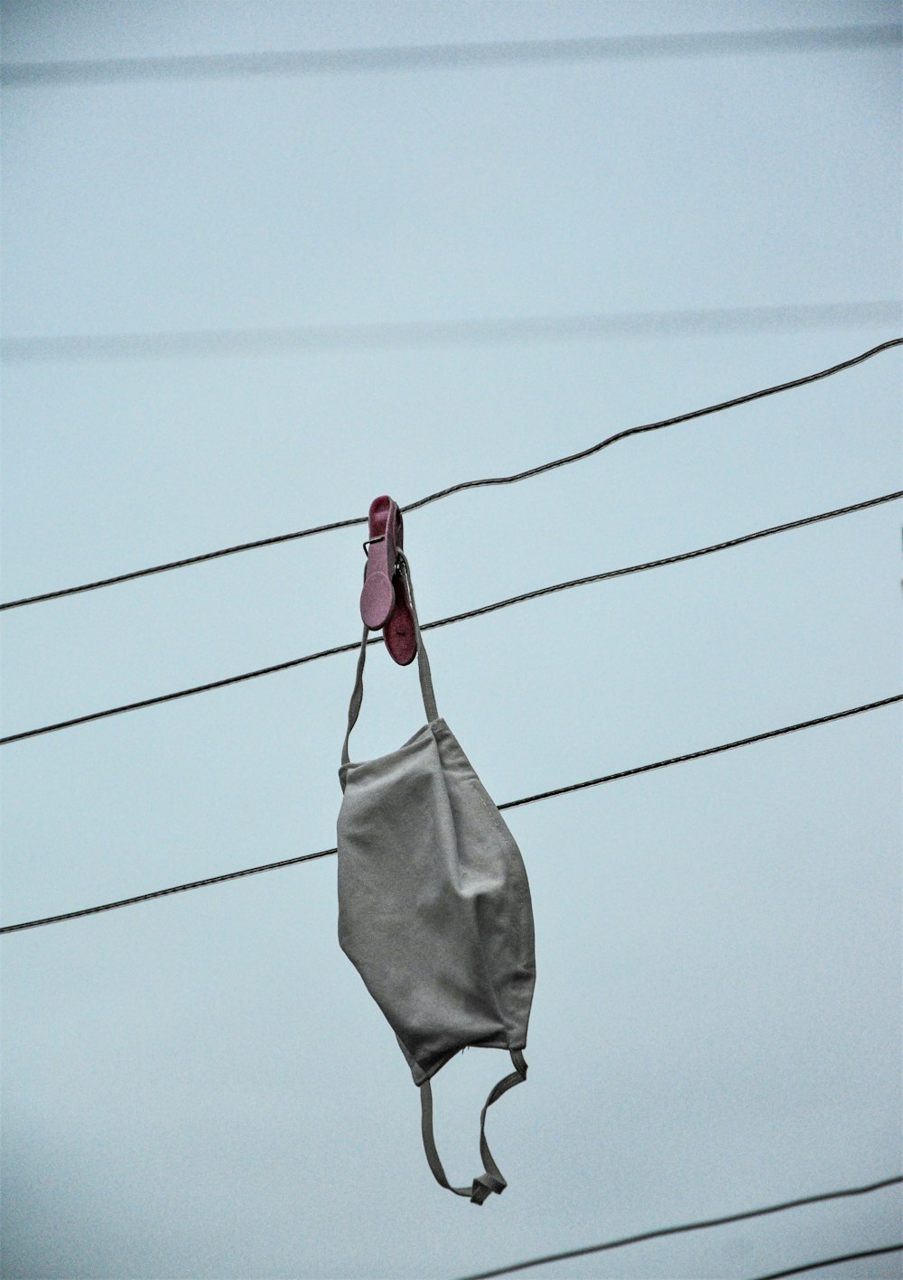 gray and red textile hanging on wire