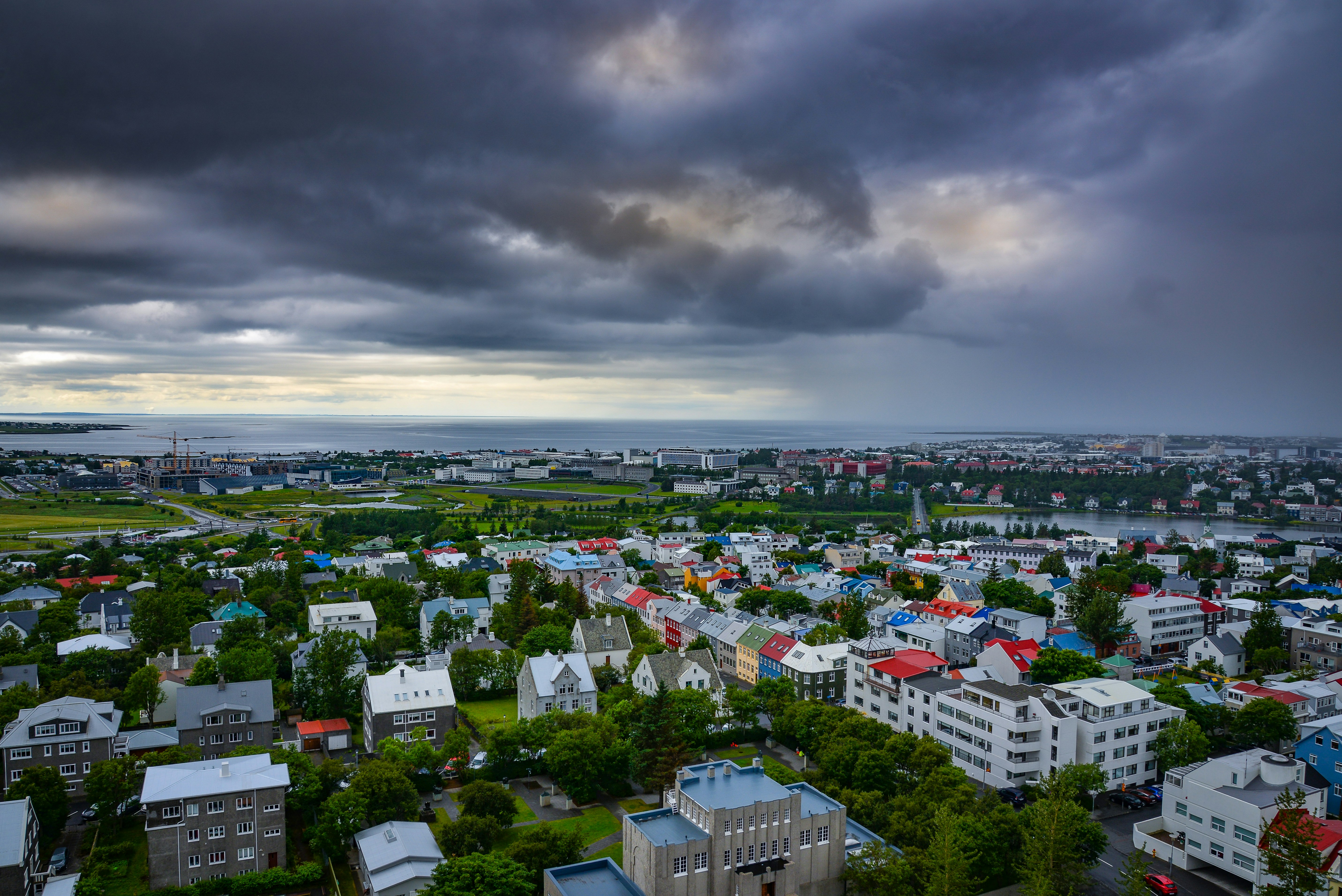 aerial view of city buildings under cloudy sky during daytime