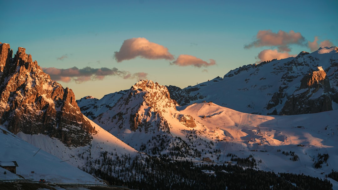 snow covered mountain under cloudy sky during daytime