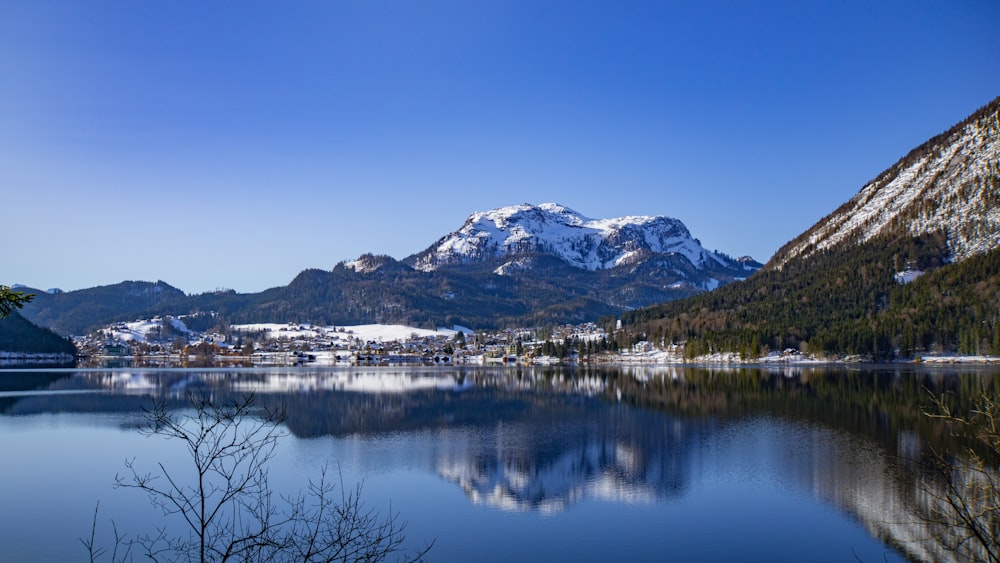 white and brown mountain near body of water during daytime