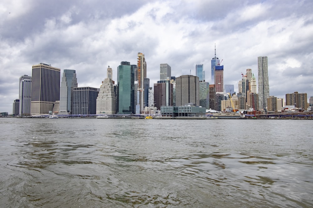 city skyline under cloudy sky during daytime