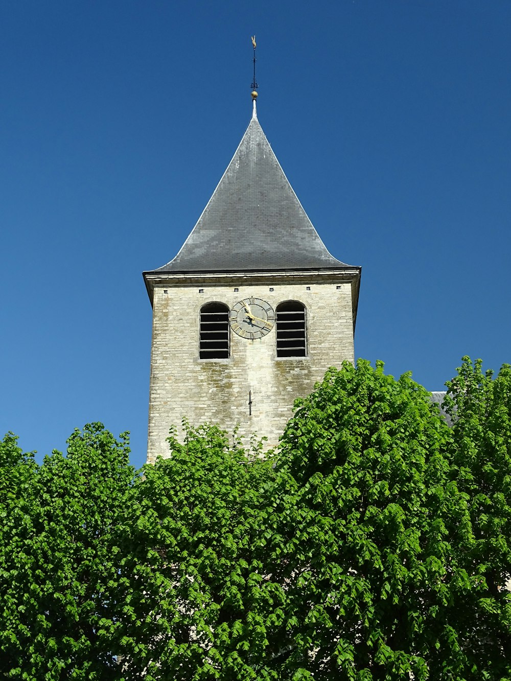 brown concrete church under blue sky during daytime