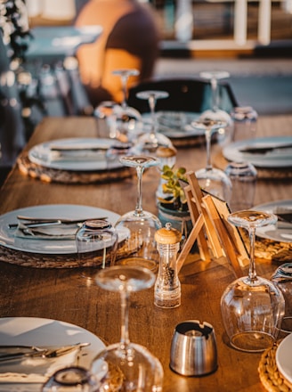 clear wine glasses on brown wooden table