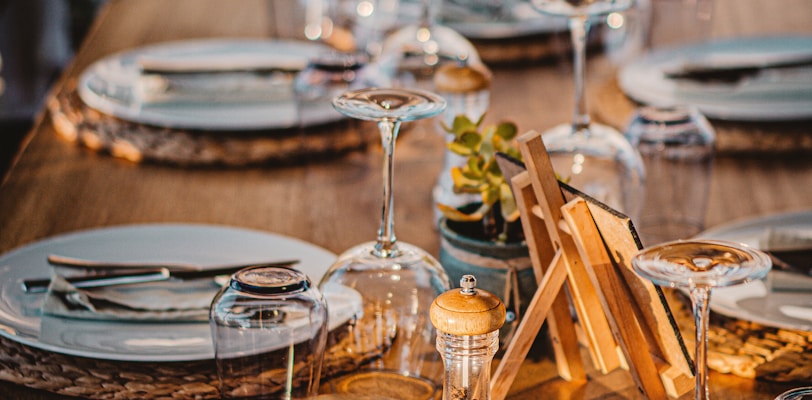 clear wine glasses on brown wooden table