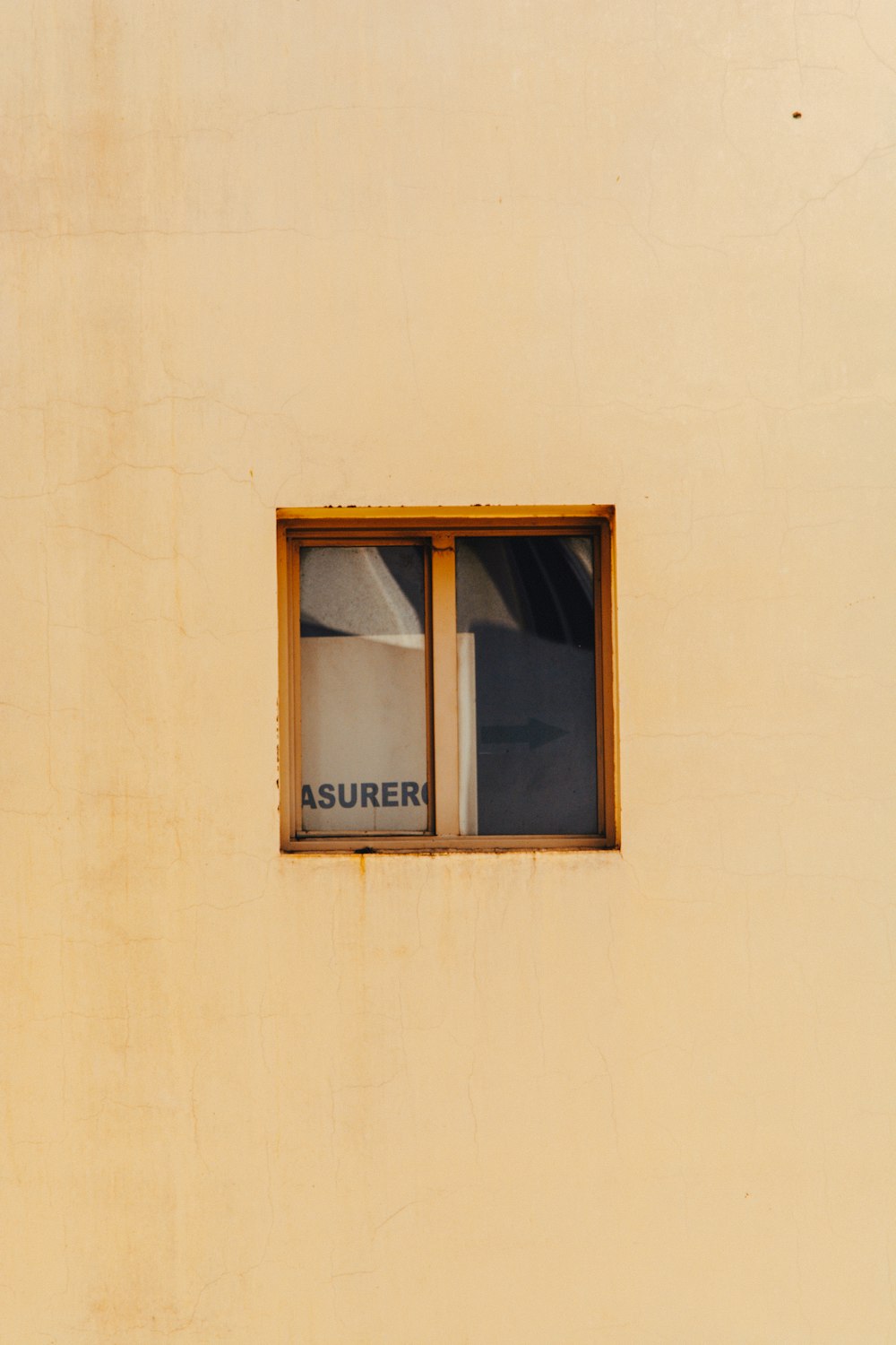 brown wooden framed glass window