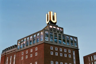 brown and black concrete building under blue sky during daytime