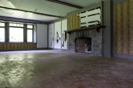 Before-and-after shots of a living room restored after fire smoke damage with fresh paint and clean surfaces.