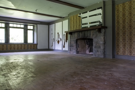 Restored living room with fresh paint and new flooring after fire cleanup.