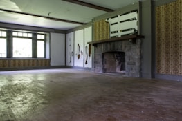 Before and after photos of a restored living room after fire damage.