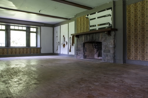 Before-and-after photo showing a living room damaged by fire and fully restored.