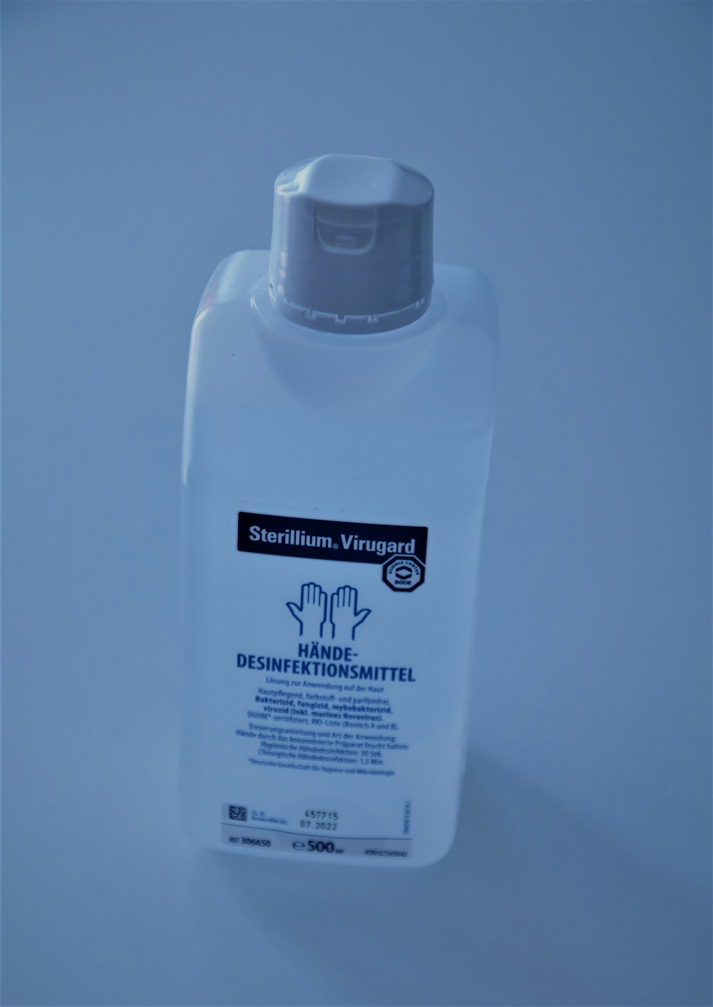 a bottle of deodorant on a white surface