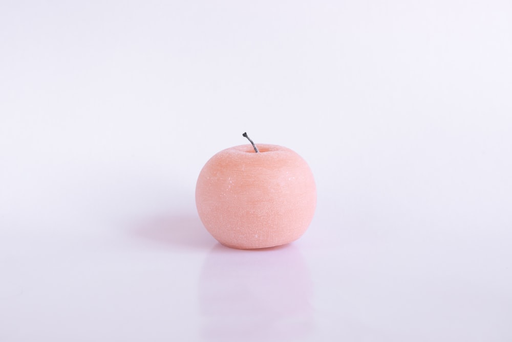 peach fruit on white table
