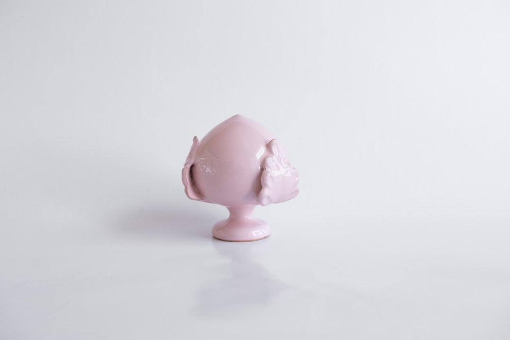 pink pig figurine on white table