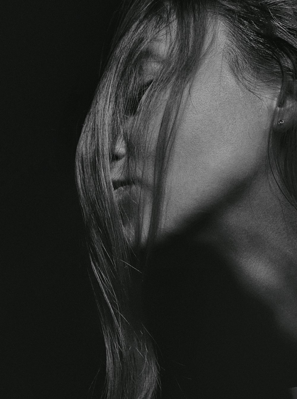 grayscale photo of womans face