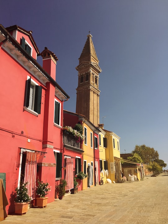 red and yellow concrete building in Kirche zum Heiligen Martin Vescovo Italy