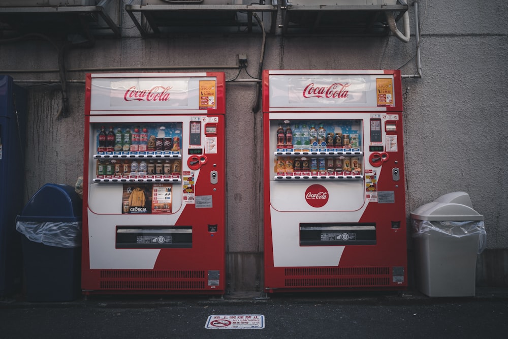 coca cola vending machine on black floor