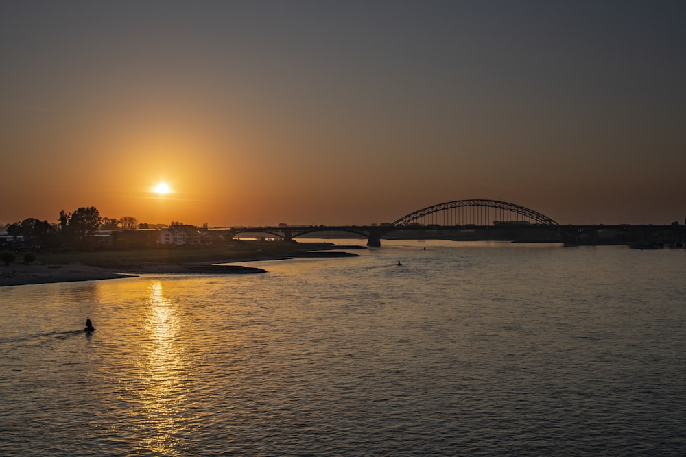 silhouette of bridge during sunset