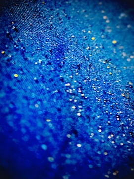 A detailed ancient scroll texture with glowing starry sky in the background.