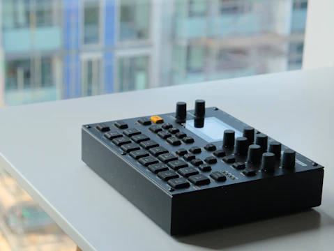 Close-up of a Hytera radio device on a table with Jakarta cityscape in the background.
