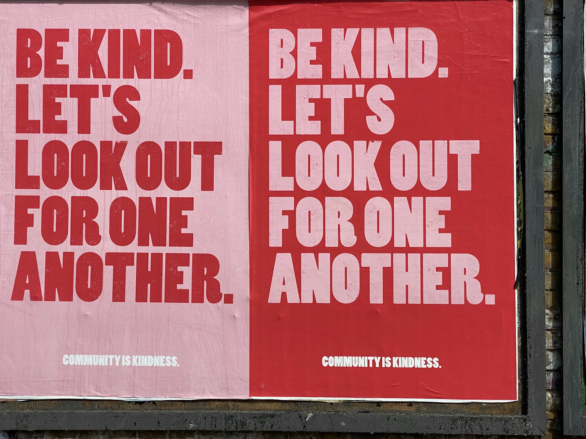 IMAGE: Posters in Brick Lane, east London, encouraging community spirit. They read "Be kind. Let's look out for one another". 