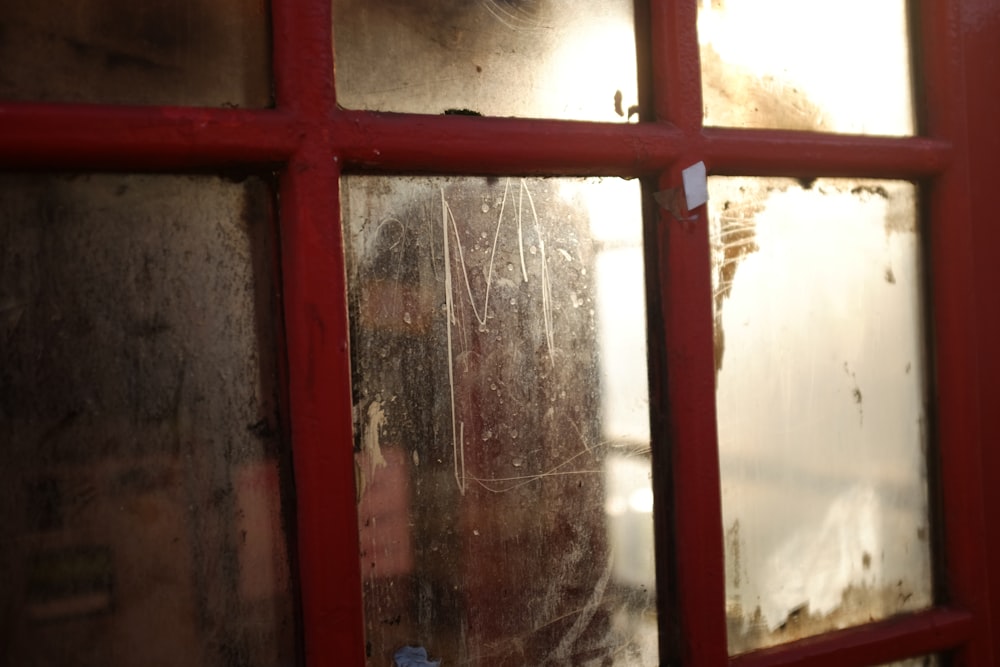 red framed glass window during daytime