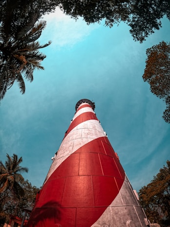 red and white tower under blue sky