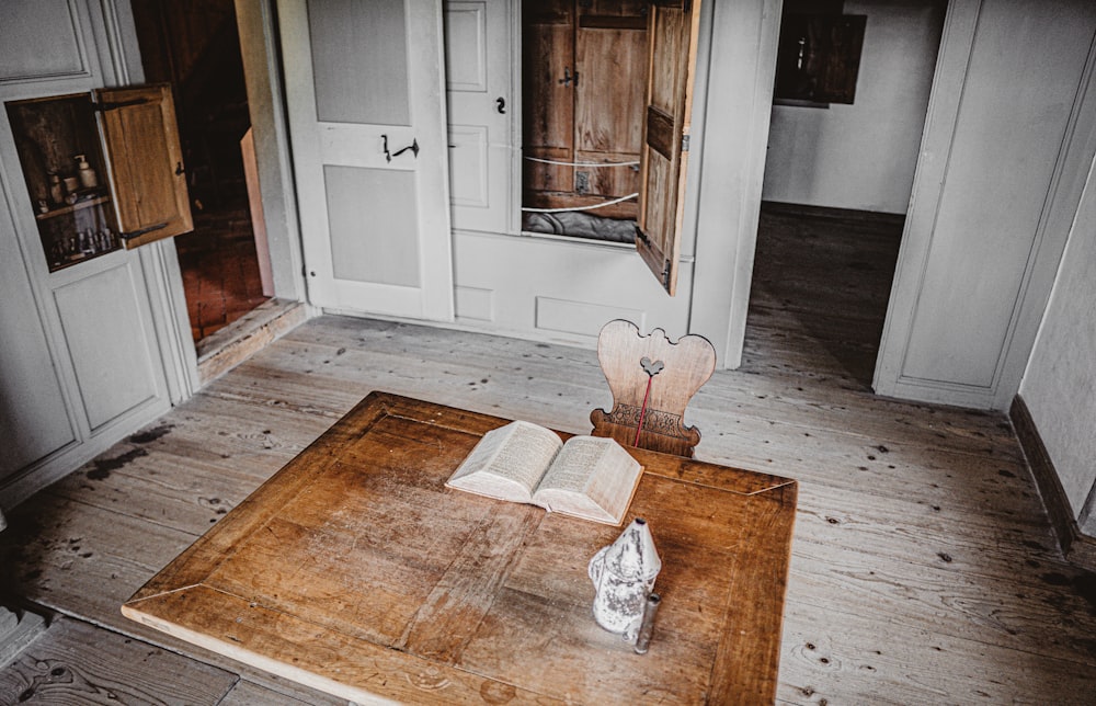 brown wooden table with white paper on top