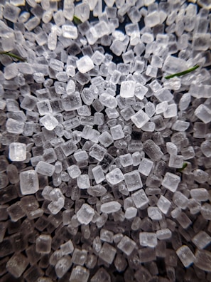 A detailed microscope image showing crystalline structures with electric green highlights.