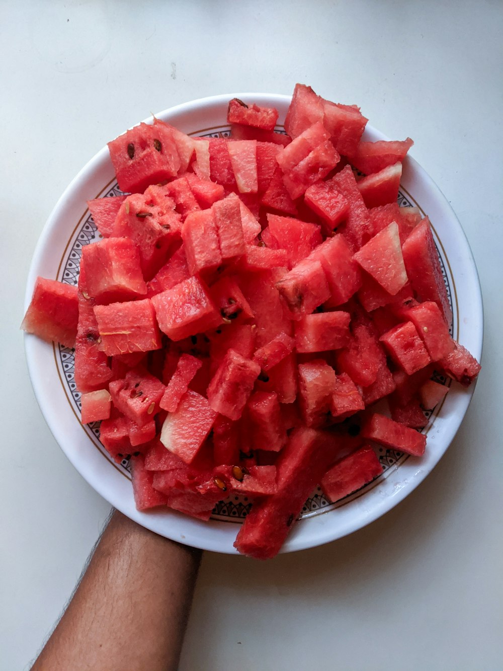 sliced watermelon on white ceramic plate